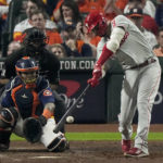 
              Philadelphia Phillies' Nick Castellanos hits a double during the seventh inning in Game 2 of baseball's World Series between the Houston Astros and the Philadelphia Phillies on Saturday, Oct. 29, 2022, in Houston. (AP Photo/Sue Ogrocki)
            