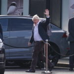 
              FILE - Former Prime Minister Boris Johnson arrives at Gatwick Airport in London, after travelling on a flight from the Caribbean, following the resignation of Liz Truss as Prime Minister, Oct. 22, 2022. Boris Johnson said Sunday Oct. 23, 2022 he will not run to lead UK Conservative Party, quashing comeback speculation. (Gareth Fuller/PA via AP, File)
            