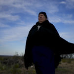 
              Mapuche Indigenous Doris Canumil woman poses for a picture at the base of the Andean Condor Conservation Program in Sierra Paileman in the Rio Negro province of Argentina, Thursday, Oct. 13, 2022, the day she held the first of two religious ceremonies for to the next day's release of two condors into the wild. For 30 years the program has hatched chicks in captivity, rehabilitated others and freed them across South America. (AP Photo/Natacha Pisarenko)
            