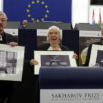 
              FILE - From left, Russia's Oleg Orlov, Lyudmila Alexeyeva and Sergei Kovalyov pose as the Russian activists received the European Union's top human rights award in recognition of the difficult conditions they face at home, Wednesday, Dec.16, 2009 in Strasbourg, at the European Parliament, France. On Friday, Oct. 7, 2022 the Nobel Peace Prize was awarded to jailed Belarus rights activist Ales Bialiatski, the Russian group Memorial and the Ukrainian organization Center for Civil Liberties. (AP Photo/Christian Lutz, File)
            