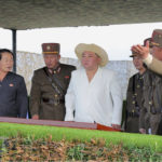 
              In this photo provided by the North Korean government, North Korean leader Kim Jong Un, center in white, inspects military exercises at an undisclosed location in North Korea, Thursday, Oct. 6, 2022. Independent journalists were not given access to cover the event depicted in this image distributed by the North Korean government. The content of this image is as provided and cannot be independently verified. Korean language watermark on image as provided by source reads: "KCNA" which is the abbreviation for Korean Central News Agency. (Korean Central News Agency/Korea News Service via AP)
            