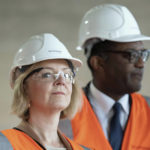 
              British Prime Minister Liz Truss and Chancellor of the Exchequer Kwasi Kwarteng visit a construction site for a medical innovation campus in Birmingham, on day three of the during day three of the Conservative Party annual conference at the International Convention Centre in Birmingham, England, Tuesday, Oct. 4, 2022. (Stefan Rousseau/Pool Photo via AP)
            
