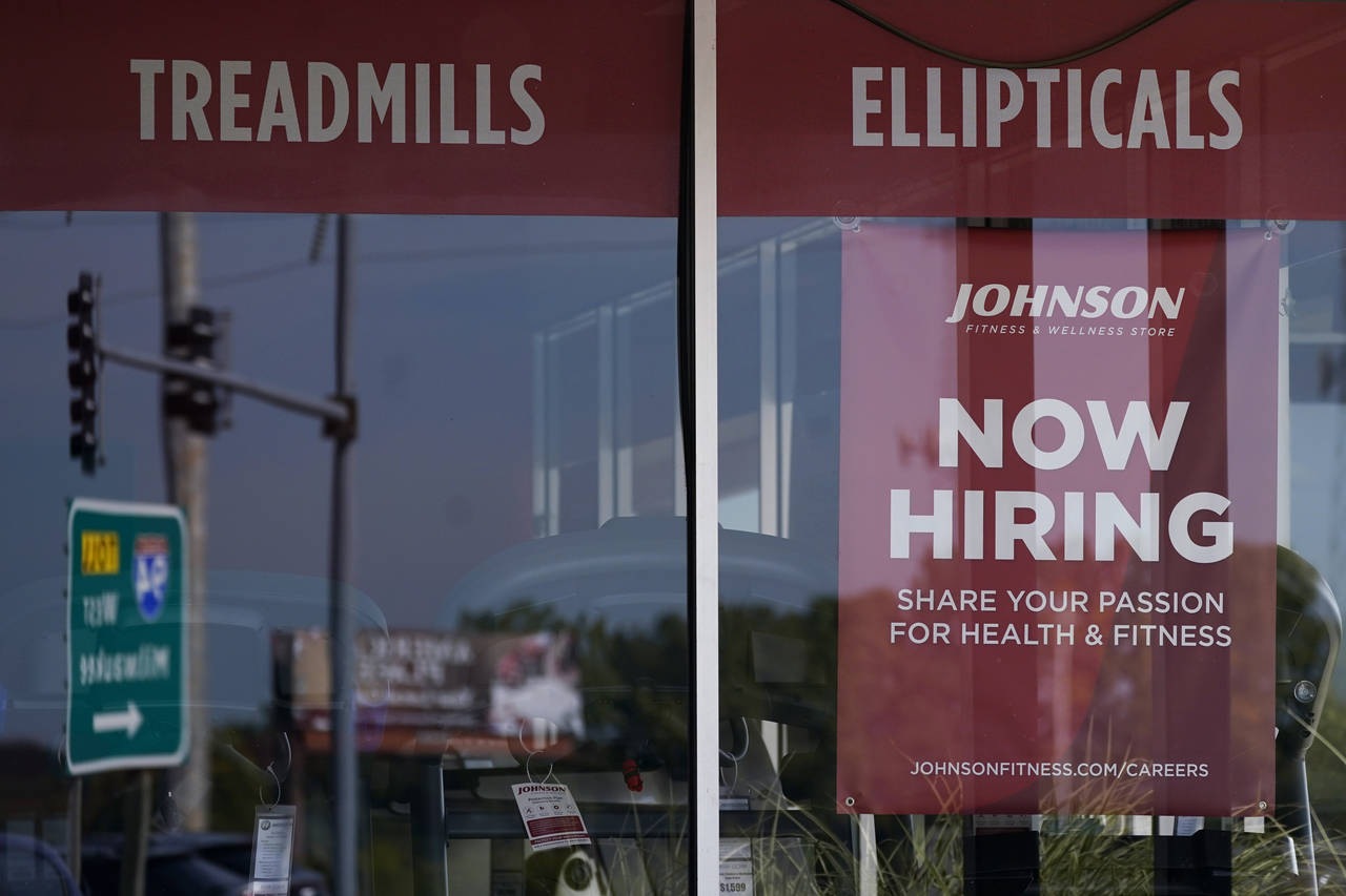 Hiring sign is displayed in Northbrook, Ill., Sept. 21, 2022. The number of Americans applying for ...