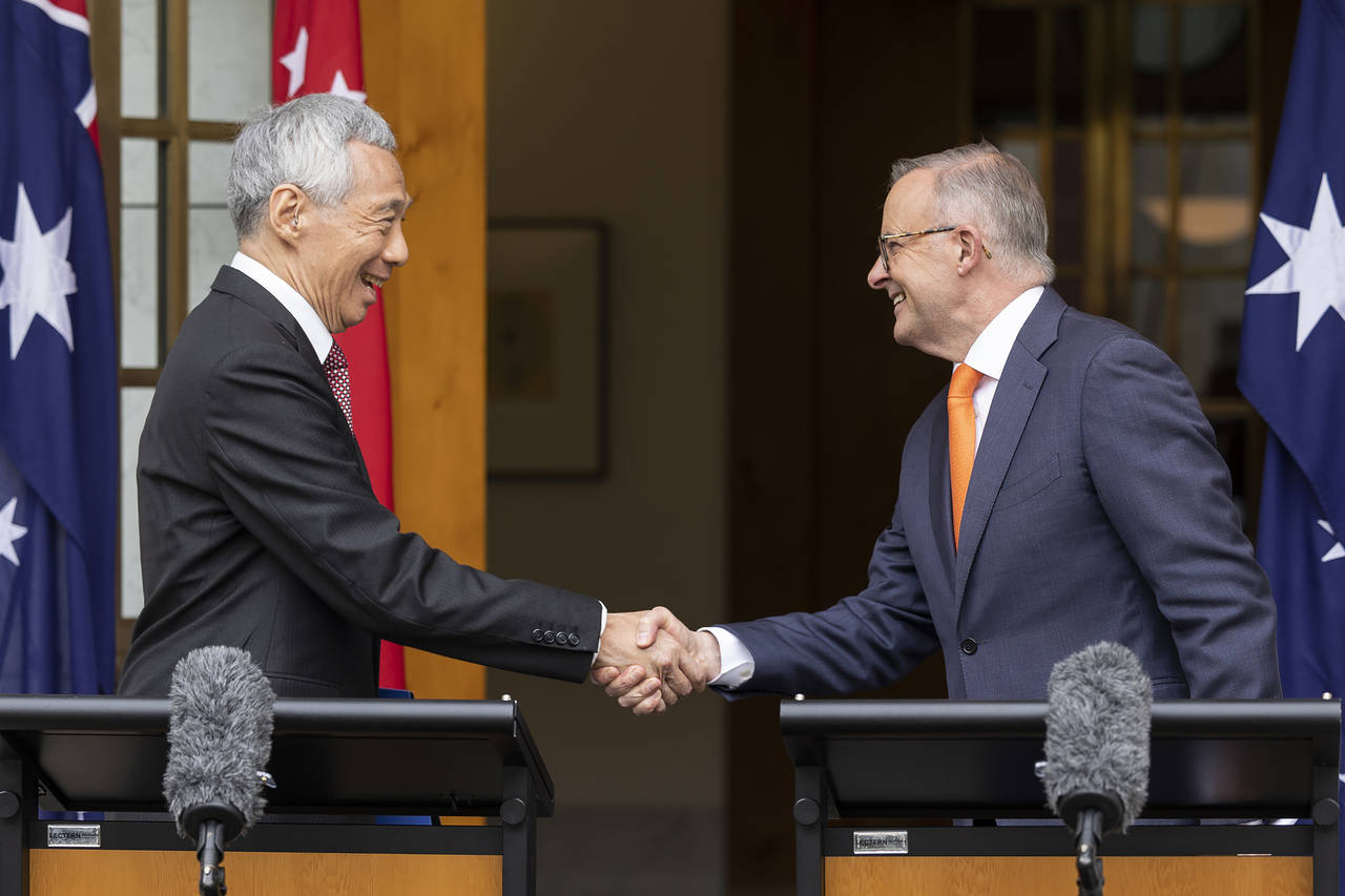 Prime Minster of Singapore Lee Hsien Loong, left, and Australia's Prime Minster Anthony Albanese sh...