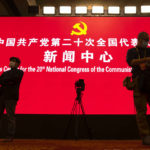 
              Attendees gather before a press conference held on the eve of the opening session of the 20th National Congress of China's ruling Communist Party in Beijing, Saturday, Oct. 15, 2022. At a two-hour news conference Saturday, the congress' spokesperson Sun Yeli reaffirmed the government's commitment to its "zero-COVID" policy, despite the economic costs, and repeated its threat to use force to annex self-governing Taiwan. (AP Photo/Mark Schiefelbein)
            