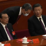 
              Chinese Premier Li Keqiang, left, and President Xi Jinping attend the closing ceremony of the 20th National Congress of China's ruling Communist Party at the Great Hall of the People in Beijing, Saturday, Oct. 22, 2022. (AP Photo/Andy Wong)
            