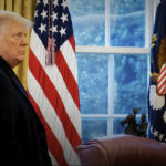 
              This exhibit from video released by the House Select Committee, shows a photo of then-President Donald Trump with his coast on as he returns to the Oval Office after speaking on the Ellipse on Jan. 6, 2021, displayed at a hearing by the House select committee investigating the Jan. 6 attack on the U.S. Capitol, Thursday, Oct. 13, 2022, on Capitol Hill in Washington. (House Select Committee via AP)
            