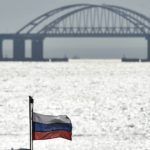 
              A view of the Crimean Bridge connecting Russian mainland and Crimean peninsula over the Kerch Strait, in Kerch, Crimea, Saturday, Oct. 8, 2022. Russian authorities say a truck bomb has caused a fire and the collapse of a section of a bridge linking Russia-annexed Crimea with Russia. The bridge is a key supply artery for Moscow's faltering war effort in southern Ukraine. (AP Photo)
            