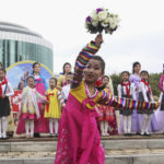 
              A group of girls performs in Changjon Street on the occasion of the 77th founding anniversary of the Worker's Party of Korea in Pyongyang, North Korea, Monday, Oct. 10, 2022. (AP Photo/Cha Song Ho)
            