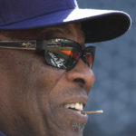 
              The MLB Post Season logo is reflected in the sunglasses of Houston Astros manager Dusty Baker Jr. during a practice ahead of Game 1 of baseball's American League Championship Series, in Houston, Tuesday, Oct. 18, 2022. (AP Photo/Eric Gay)
            