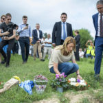 
              European Parliament, Roberta Metsola, lays flowers during a silent gathering to remember Daphne Caruana Galizia, at the same place where she was killed in Bidnija fields, Malta, Sunday, Oct. 16, 2022. Malta on Sunday marked the fifth anniversary of the car bomb slaying of investigative journalist Daphne Caruana Galizia, just two days after two key suspects reversed course and pleaded guilty to the murder on the first day of their trial. (AP Photo/Rene' Rossignaud)
            