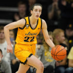 
              FILE - Iowa guard Caitlin Clark drives up court during the second half of an NCAA college basketball game against Michigan, Sunday, Feb. 27, 2022, in Iowa City, Iowa. Clark is a unanimous choice to the women's Associated Press preseason All-America team, Tuesday, Oct. 25, 2022.(AP Photo/Charlie Neibergall, File)
            