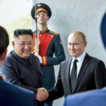 
              FILE - Russian President Vladimir Putin, center right, and North Korea's leader Kim Jong Un shake hands during their meeting in Vladivostok, Russia on April 25, 2019. As North Korea conducts more powerful weapons tests — and threatens pre-emptive nuclear strikes on Washington and Seoul — it may be taking inspiration from the fiery rhetoric of the leader of a nuclear-armed member of the U.N. Security Council: Russia's Vladimir Putin. (Yuri Kadobnov/Pool Photo via AP, File)
            