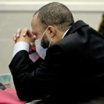 
              Darrell Brooks reacts as the guilty verdict is read during his trial in a Waukesha County Circuit Court in Waukesha, Wis., on Wednesday, Oct. 26, 2022. Brooks represented himself during the trial and was charged with driving into a Waukesha Christmas Parade last year, killing six people and injuring dozens more. Brooks was found guilty Wednesday of all 76 charges, including six counts of first-degree intentional homicide. (Mike De Sisti/Milwaukee Journal-Sentinel via AP, Pool)
            