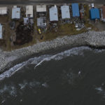 
              Small waves crash into reinforced seawalls in Shishmaref, Alaska, Tuesday, Oct. 4, 2022. Rising sea levels, flooding, increased erosion and loss of protective sea ice and land have led residents of this island community to vote twice to relocate. But more than six years after the last vote, Shishmaref remains in the same place because the relocation is too costly. (AP Photo/Jae C. Hong)
            