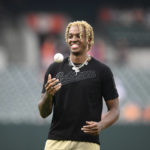 
              FILE - North Carolina basketball player Armando Bacot pauses before he threw out a ceremonial first pitch before a baseball game between the Baltimore Orioles and the Tampa Bay Rays, Friday, May 20, 2022, in Baltimore. Bacot was named to The Associated Press preseason All-America team, Monday, Oct. 24, 2022.(AP Photo/Nick Wass, File)
            