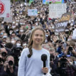 
              FILE --Swedish climate activist Greta Thunberg stands onstage during a Fridays for Future global climate strike in Berlin, Germany, Friday, Sept. 24, 2021. Climate activist Greta Thunberg says it would be “a mistake” for Germany to switch off its nuclear power plants if that means burning more planet-heating coal.  (AP Photo/Markus Schreiber,file)
            