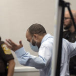 Darrell Brooks argues with the judge before making his closing arguments in his trial in Waukesha County Circuit Court, Tuesday, Oct. 25, 2022, in Waukesha, Wis. Brooks, who is representing himself during the trial, is charged with driving into a Waukesha Christmas Parade last year, killing six people and injuring dozens more. (Mark Hoffman/Milwaukee Journal-Sentinel via AP, Pool)