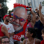 
              Supporters of Brazil's former President Luiz Inacio Lula da Silva, who is running for president again, celebrate partial results after polls closed in the country's presidential run-off election, in Rio de Janeiro, Brazil, Sunday, Oct. 30, 2022. (AP Photo/Bruna Prado)
            