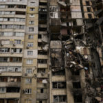 
              Debris hang from a partially destroyed residential building at Saltivka neighbourhood in Kharkiv, Ukraine, Monday, Oct. 3, 2022. (AP Photo/Francisco Seco)
            