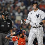 
              New York Yankees Aaron Judge reacts after striking out against the Houston Astros during the fourth inning of Game 3 of an American League Championship baseball series, Saturday, Oct. 22, 2022, in New York. (AP Photo/John Minchillo)
            