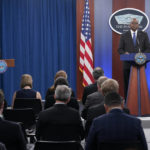 Defense Secretary Lloyd Austin, right, speaks during a briefing at the Pentagon in Washington, Thursday, Oct. 27, 2022, moderated by Pentagon spokesman Air Force Brig. Gen. Patrick Ryder, left. (AP Photo/Susan Walsh)