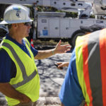 Florida Power and Light CEO Eric Silagy visits workers restoring power in Naples, Fla., on Monday, Oct. 3, 2022. Silagy says that he expects crews to be finished restoring power to habitable homes impacted by Hurricane Ian by the end of the week. (AP Photo/Robert Bumsted)