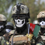 
              FILE - New Afghan Army special forces members attend their graduation ceremony after a three-month training program at the Kabul Military Training Center (KMTC) in Kabul, Afghanistan, Saturday, July 17, 2021. Afghan special forces soldiers who fought alongside American troops and then fled to Iran after the chaotic U.S. withdrawal last year are now being recruited by the Russian military to fight in Ukraine, three former Afghan generals told The Associated Press. (AP Photo/Rahmat Gul, File)
            