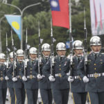 
              The military honor guard attend National Day celebrations in front of the Presidential Building in Taipei, Taiwan, Monday, Oct. 10, 2022. (AP Photo/Chiang Ying-ying)
            