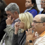 
              From left; Abby Hoyer, Tom and Gena Hoyer, and Michael Schulman react during the reading of jury instructions in the penalty phase of the trial of Marjory Stoneman Douglas High School shooter Nikolas Cruz at the Broward County Courthouse in Fort Lauderdale, Fla. on Wednesday, Oct. 12, 2022. The Hoyer's son, Luke, and Schulman's son, Scott Beigel, were killed in the 2018 shootings. Abby Hoyer is Luke Hoyer's sister. Cruz previously plead guilty to all 17 counts of premeditated murder and 17 counts of attempted murder in the 2018 shootings. (Amy Beth Bennett/South Florida Sun Sentinel via AP, Pool)
            