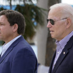 
              President Joe Biden and Florida Gov. Ron DeSantis arrive to tour an area impacted by Hurricane Ian on Wednesday, Oct. 5, 2022, in Fort Myers Beach, Fla. (AP Photo/Evan Vucci)
            