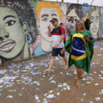 
              Voters arrive to a polling station during general elections in Brasilia, Brazil, Sunday, Oct. 2, 2022. (AP Photo/Eraldo Peres)
            