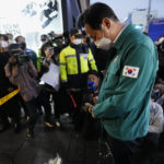 
              Seoul's Mayor Oh Se-hoon pays tribute for victims at the scene of a deadly accident in Seoul, South Korea, Sunday, Oct. 30, 2022, following Saturday night's Halloween festivities. A mass of mostly young people among tens of thousands who gathered to celebrate Halloween in Seoul became trapped and crushed as the crowd surged into a narrow alley, killing dozens of people and injuring dozens of others in South Korea’s worst disaster in years. (AP Photo/Ahn Young-joon)
            