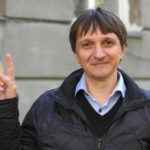 
              Volodymyr Yavorskyi, the expert of the Center of Civil Liberties, shows a V-sign in Kyiv, Ukraine, Friday, Oct. 7, 2022. On Friday, Oct. 7, 2022 the Nobel Peace Prize was awarded to jailed Belarus rights activist Ales Bialiatski, the Russian group Memorial and the Ukrainian organization Center for Civil Liberties. (AP Photo/Efrem Lukatsky)
            