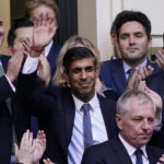 
              Rishi Sunak, centre, waves after winning the Conservative Party leadership contest at the Conservative party Headquarters in London, Monday, Oct. 24, 2022. Former British Treasury chief Rishi Sunak is frontrunner in the Conservative Party's race to replace Liz Truss as prime minister. (AP Photo/Aberto Pezzali)
            