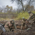 
              Ukrainian soldiers fire a mortar in the front line near Bakhmut, the site of the heaviest battle against the Russian troops in the Donetsk region, Ukraine, Thursday, Oct. 27, 2022. (AP Photo/Efrem Lukatsky)
            