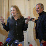 
              French author Annie Ernaux, left, and Chairman of French publishing house Gallimard, Antoine Gallimard, right, at the end of a press conference after Ernaux was awarded 2022's Nobel Prize in literature, in Paris, Thursday, Oct. 6, 2022. The 82-year-old was cited for "the courage and clinical acuity with which she uncovers the roots, estrangements and collective restraints of personal memory," the Nobel committee said. (AP Photo/Michel Euler)
            