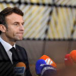
              France's President Emmanuel Macron speaks with the media as he arrives for an EU summit in Brussels, Thursday, Oct. 20, 2022. European Union leaders were heading into a two-day summit Thursday with opposing views on whether, and how, the bloc could impose a gas price cap to contain the energy crisis fueled by Russian President Vladimir Putin's invasion of Ukraine and his strategy to choke off gas supplies to the bloc at will. (AP Photo/Geert Vanden Wijngaert)
            