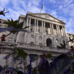 The Bank of England stands in the financial district of The City of London, Wednesday, Oct. 12, 2022. The pound sank against the dollar early Wednesday after the Bank of England governor confirmed the bank won't extend an emergency debt-buying plan introduced last month to stabilize financial markets. (AP Photo/Alberto Pezzali)