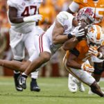 
              Alabama linebacker Henry To'oTo'o (10) tries to make an interception of a pass intended for Tennessee running back Jabari Small (2) during the first half of an NCAA college football game Saturday, Oct. 15, 2022, in Knoxville, Tenn. (AP Photo/Wade Payne)
            
