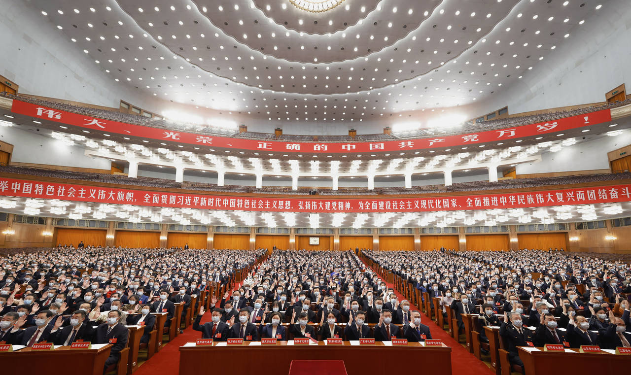 In this photo released by Xinhua News Agency, delegates attend a preparatory meeting ahead of the 2...