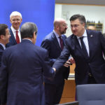 
              Croatia's Prime Minister Andrej Plenkovic, second right, greets Cypriot President Nicos Anastasiades, center, during a round table meeting at an EU summit in Brussels, Friday, Oct. 21, 2022. European Union leaders are gathering Friday to take stock of their support for Ukraine after President Volodymyr Zelenskyy warned that Russia is trying to spark a refugee exodus by destroying his war-ravaged country's energy infrastructure. (AP Photo/Geert Vanden Wijngaert)
            