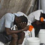 
              FILE - Patients with cholera symptoms sit in an observation center at a cholera clinic run by Doctors Without Borders in Port-au-Prince, Haiti, Friday, Oct. 7, 2022. The World Health Organization and partners are recommending that countries temporarily switch to using a single dose of the cholera vaccine _ instead of two _ due to a global vaccine shortage as outbreaks of the water-borne disease surge globally. (AP Photo/Odelyn Joseph, File)
            