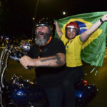 
              Supporter of Brazilian President Jair Bolsonaro, who is running for another term, ride a motorcycle after the general election polls closed in Brasilia, Brazil, Sunday, Oct. 2, 2022. (AP Photo/Ton Molina)
            
