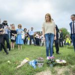 
              European Parliament, Roberta Metsola, lays flowers during a silent gathering to remember Daphne Caruana Galizia, at the same place where she was killed in Bidnija fields, Malta, Sunday, Oct. 16, 2022. Malta on Sunday marked the fifth anniversary of the car bomb slaying of investigative journalist Daphne Caruana Galizia, just two days after two key suspects reversed course and pleaded guilty to the murder on the first day of their trial. (AP Photo/Rene' Rossignaud)
            