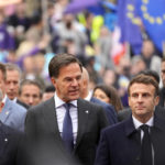 
              From left, Germany's Chancellor Olaf Scholz, Netherland's Prime Minister Mark Rutte and French President Emmanuel Macron arrive for an EU Summit at Prague Castle in Prague, Czech Republic, Friday, Oct 7, 2022. European Union leaders converged on Prague Castle Friday to try to bridge significant differences over a natural gas price cap as winter approaches and Russia's war on Ukraine fuels a major energy crisis. (AP Photo/Darko Bandic)
            