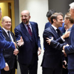 
              From left, Romania's President Klaus Werner Ioannis, Germany's Chancellor Olaf Scholz, European Council President Charles Michel, Spain's Prime Minister Pedro Sanchez, France's President Emmanuel Macron, Denmark's Prime Minister Mette Frederiksen and Latvia's Prime Minister Krisjanis Karins during a round table meeting at an EU summit in Brussels, Friday, Oct. 21, 2022. European Union leaders gathered Friday to take stock of their support for Ukraine after President Volodymyr Zelenskyy warned that Russia is trying to spark a refugee exodus by destroying his war-ravaged country's energy infrastructure. (AP Photo/Geert Vanden Wijngaert)
            