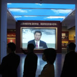 
              Visitors to the Museum of the Communist Party of China past by a screen showing Chinese President Xi Jinping in Beijing, Wednesday, Oct. 12, 2022. For decades Chinese journalist Ho Pin has successfully predicted rising newcomers in the Chinese Communist Party, and says that leader Xi Jinping is so powerful, there is little point in predicting the leadership line up to be announced at the Communist Party congress that begins Sunday. (AP Photo/Ng Han Guan)
            