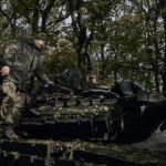 
              Ukrainian servicemen prepare to fire a tank near Bakhmut, Donetsk region, Ukraine, Saturday, Oct. 22, 2022. (AP Photo/LIBKOS)
            