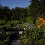 
              Flowers frame the entrance of the White House Kitchen Garden during the White House Fall Garden Tour in Washington, Saturday, Oct. 8, 2022. (AP Photo/Carolyn Kaster)
            